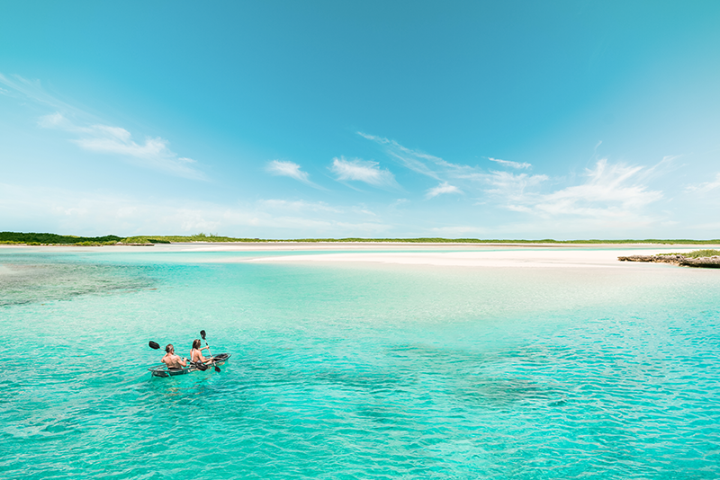 Kayaking over a shallow sandbank
